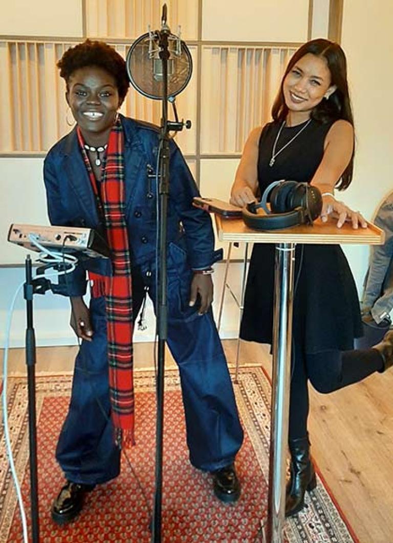 picture of Ah Moon and the guest artist Wiyaala in front of a microphone