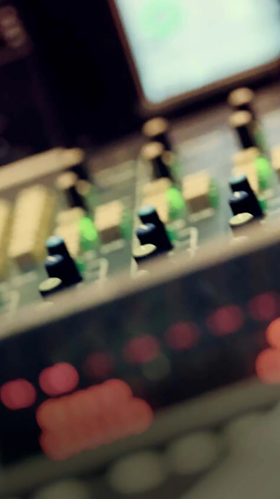 A blurred picture of a mixing desk