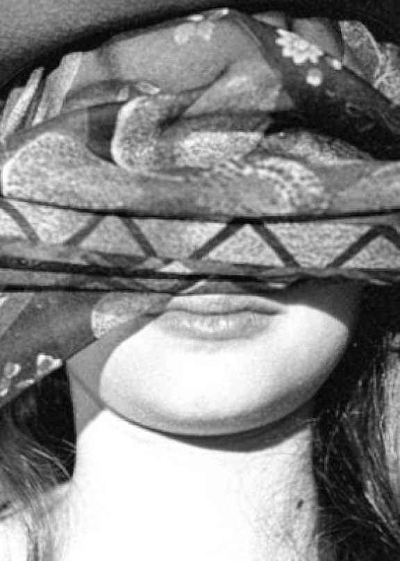 A female face covered with a scarf
