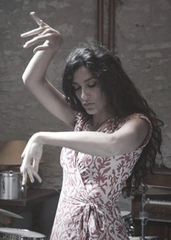 A dancing woman wearing a dress