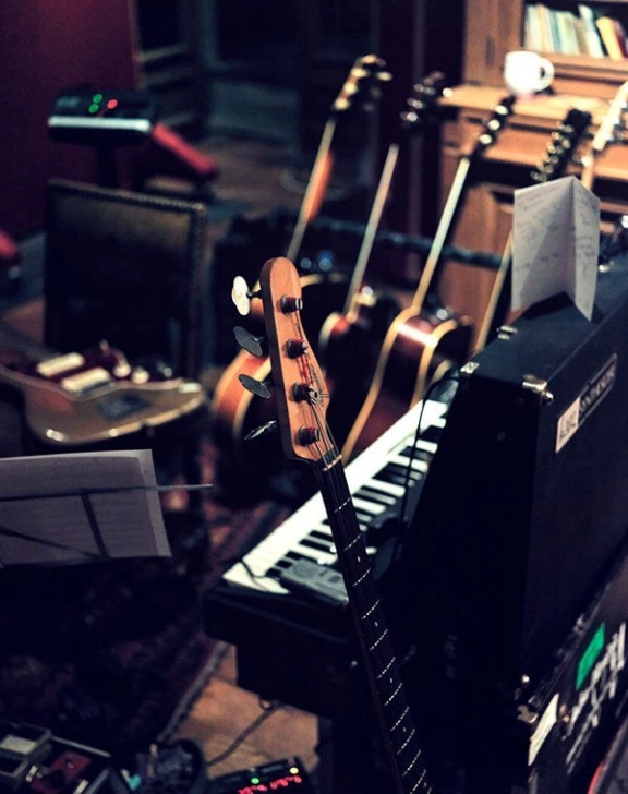 Recording studio with various guitars and keys