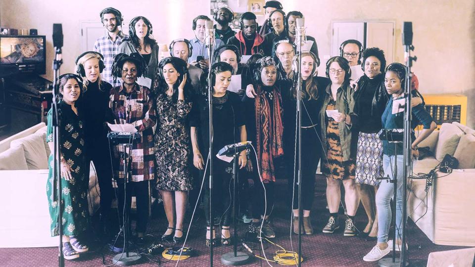 image of a group of Beyond Music singers in front of microphones